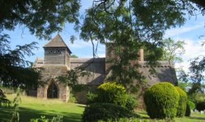 Brockhampton Parish Church with a beautiful thatch roof.